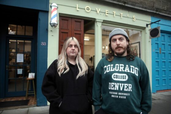 Lovett's owners Emily Mckendrick and Liam Thomson outside the barber shop.