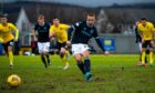 Dundee striker Leigh Griffiths scores from the spot against Dumbarton.