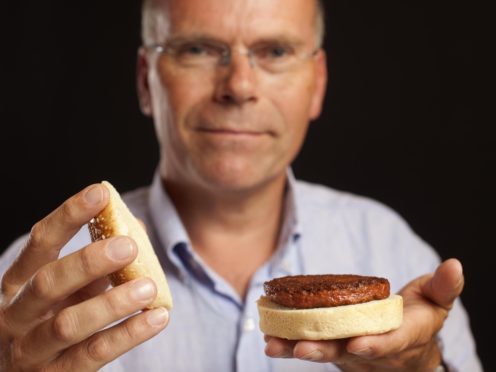 Professor Mark Post with a lab-grown meat burger (David Parry/PA)