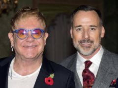 Sir Elton John and David Furnish accepted libel damages at London’s High Court (Hannah McKay/PA)