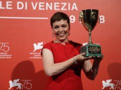 Olivia Colman holds the Coppa Volpi Best Actress award (Kirsty Wigglesworth/AP)