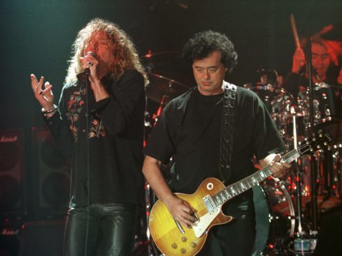 Led Zeppelin’s Robert Plant, left, performs with guitarist Jimmy Page (AP Photo/Murad Sezer)