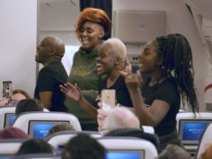 The Kingdom Choir perform Stand By Me aboard a flight to Australia (British Airways/PA)