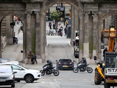 Filming for a car chase scene involving a McLaren sports car and motorbikes takes place in Glasgow city centre (Jane Barlow/PA)