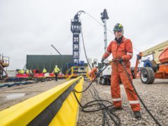 A worker at the Cuadrilla fracking site in Preston New Road (Danny LAwson/PA)