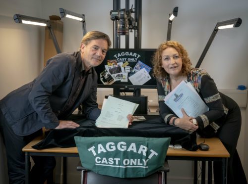 Taggart stars Blythe Duff and John Michie hand over scripts and memorabilia from the famous police drama (GCU/PA)