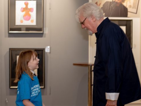 Primary pupil Abby McConnell was delighted to meet her hero, Sir Billy Connolly (Rosaleen Bonnar Photoworks/PA)