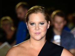 Amy Schumer and her husband, Chris Fischer, announced in late October that they were expecting their first child together (Ian West/PA)