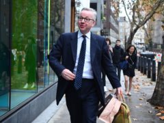 Environment Secretary Michael Gove arrives at his office in Westminster, London.