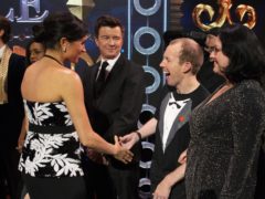 The Duchess of Sussex meets Rick Astley and Lost Voice Guy on stage at the Royal Variety Performance at the London Palladium in central London.