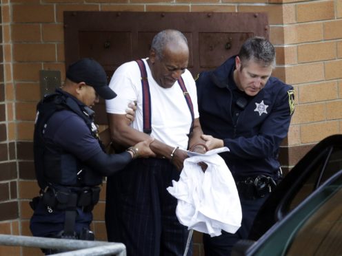 Bill Cosby is escorted out after his sentencing (Jacqueline Larma/AP)