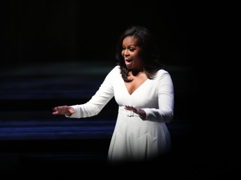 Michelle Obama acknowledges the crowd at the Royal Festival Hall (PA)