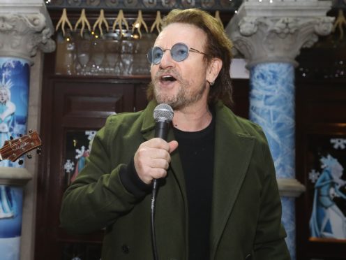 Bono urged people to dig deep into their pockets and bring hope to the homeless as he led a Christmas Eve busk in Dublin city centre (Lorraine O’Sullivan/PA).