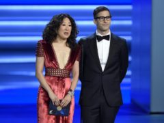 Sandra Oh and Andy Samberg present an award at the 70th Primetime Emmy Awards in Los Angeles (Chris Pizzello/Invision/AP)