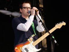 Weezer singer Rivers Cuomo performing on the main stage at the Carling Weekend music festival in Reading.
