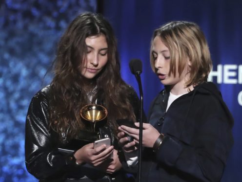 Toni Cornell, left, and Christopher Nicholas Cornell accept the award for best rock performance for When Bad Does Good on behalf of their late father Chris Cornell (Matt Sayles/Invision/AP)
