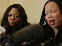 Rochelle Washington, left, cries as Latresa Scaff details their sexual misconduct accusations (Seth Wenig/AP)