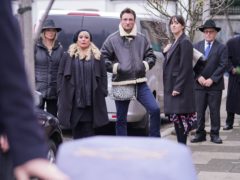 EastEnders characters gather for the funeral of Dr Legg (Kieron McCarron/BBC)