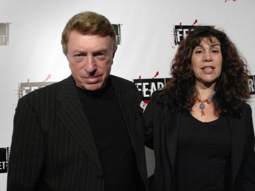 Larry Cohen, pictured with his wife, has died (Phil McCarten/AP)