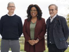 (From left to right) Apple CEO Tim Cook, Oprah Winfrey and Steven Spielberg pose for a photo outside the Steve Jobs Theater during an event to announce new Apple products (Tony Avelar/AP)