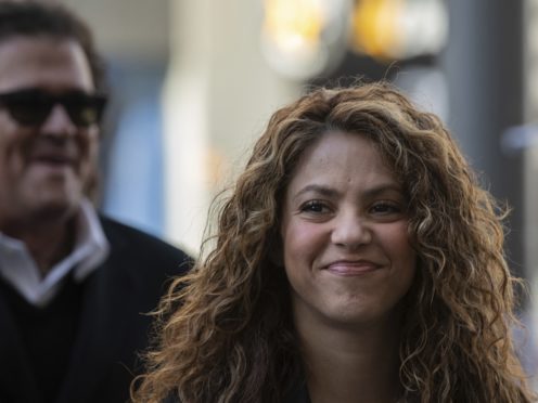 Colombian singers Shakira, right, and Carlos Vives, background, arrive at court (Bernat Armangue/AP)