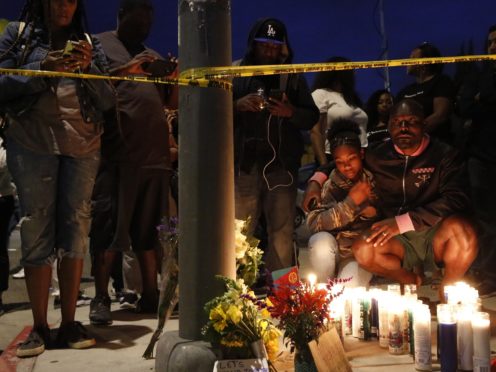 Tributes outside the clothes shop of Nipsey Hussle (Damian Dovarganes/AP)