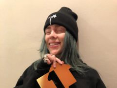 Embargoed to 1800 Friday April 5 Undated handout photo issued by the Official Charts Company of Billie Eilish, celebrating after her debut album, When We All Fall Asleep, Where Do We Go?, topped this week’s Official Albums Chart.