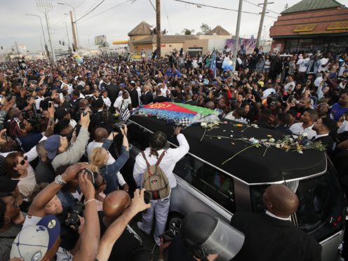 A hearse carrying the coffin of Nipsey Hussle passes through Los Angeles (Jae C Hong/AP)