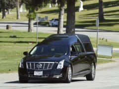 A hearse leaves a burial service for the late rapper Nipsey Hussle at Forest Lawn Hollywood Hills cemetery (Photo by Chris Pizzello/Invision/AP)