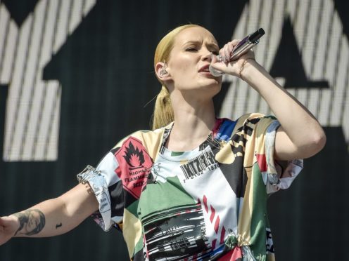 Rapper Iggy Azalea has vowed to take legal action after topless pictures taken for a magazine photoshoot were leaked online (Ben Birchall/PA)