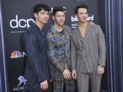 Joe Jonas, from left, Nick Jonas, and Kevin Jonas, of Jonas Brothers, arrive at the Billboard Music Awards (Richard Shotwell/Invision/AP)