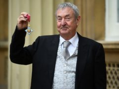 Pink Floyd drummer Nick Mason with his CBE for services to music (Kirsty O’Connor/PA)