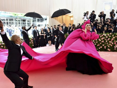 Lady Gaga arrived in a giant hot-pink gown and ended up in sparkling black lingerie (Charles Sykes/Invision/AP)