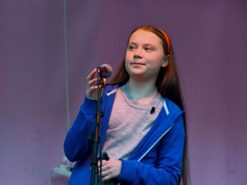 16-year-old Swedish climate activist Greta Thunberg addresses the Extinction Rebellion demonstrators at Marble Arch in London (PA)