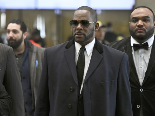 Musician R. Kelly, centre, arrives for a court hearing in Chicago (Matt Marton/AP)