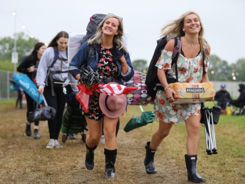 People arrive on the first day of the Glastonbury Festival at Worthy Farm in Somerset (Aaron Chown/PA)