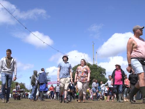 Attendees arrive at the Isle of Wight Festival (Ed Lawrence/PA)