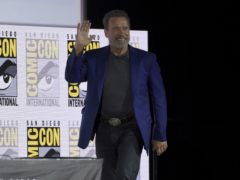 Arnold Schwarzenegger walks on stage at the Terminator: Dark Fate panel on day one of Comic-Con International (Chris Pizzello/Invision/AP)