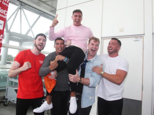 Love Island winner Greg O’Shea with friends (Yui Mok/PA)