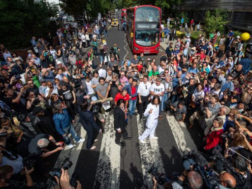 Hundreds of Beatles fans flock to Abbey Road on photo’s 50th anniversary (Dominic Lipinski/PA)