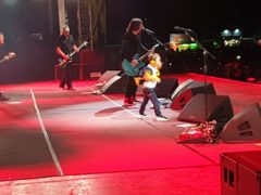 Taylor Blackburn, 5, joins the Foo Fighters on stage in Belfast (Nikki Blackburn/PA)