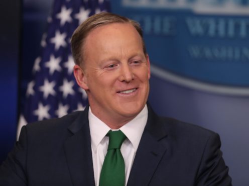 Donald Trump’s former press secretary made his Dancing With The Stars debut while performing the salsa wearing a neon green ruffled shirt (Niall Carson/PA)