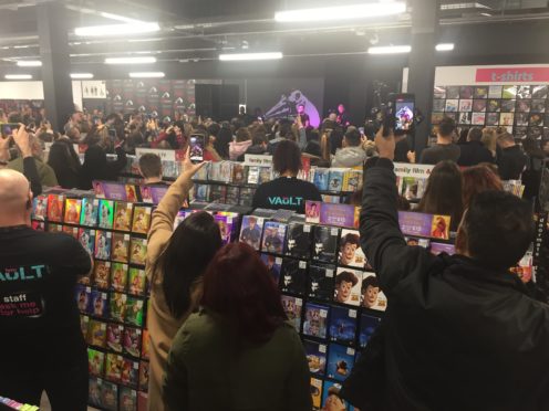 Fans watch former One Direction star Liam Payne performing at the opening of the HMV Vault store in Dale End, Birmingham (Matthew Cooper/PA)