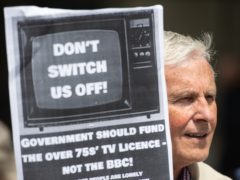 Demonstrators protest outside BBC Broadcasting House over the corporation’s decision to means-test the TV licence (Dominic Lipinski/PA)