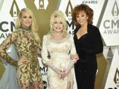 Carrie Underwood, Dolly Parton, and Reba McEntire at the 53rd annual CMA Awards (Evan Agostini/Invision/AP)