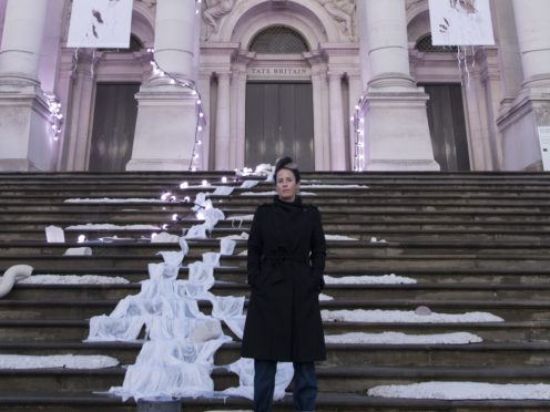 Artist Anne Hardy standing next to her artwork at Tate Britain (Tate Britain/PA)