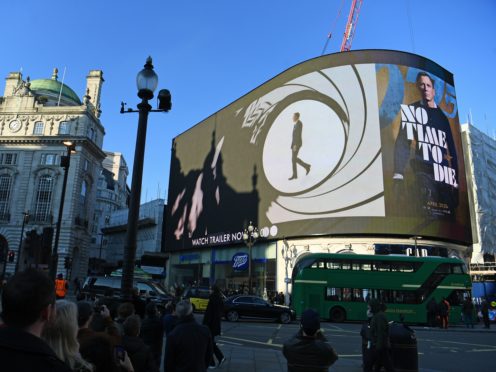 The trailer for the latest Bond film No Time to Die is aired for the first time on the large screen in London’s Piccadilly Circus (Victoria Jones/PA)
