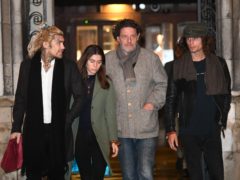 Marco Pierre White, centre right, leaves the Royal Courts of Justice in London accompanied by his children Marco White Jr, left, and Luciano White, right (Victoria Jones/PA)