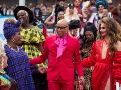 RuPaul with performers at RuPaul’s DragCon UK convention (Dominic Lipinski/PA)