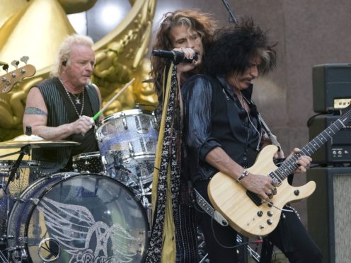 Drummer Joey Kramer, singer Steven Tyler and guitarist Joe Perry of Aerosmith perform together in 2018. A judge has denied Kramer’s bid to rejoin the band for Grammy week (Charles Sykes/AP)